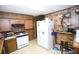 Kitchen with light countertops and white appliances, including fridge and stove at 3043 Alston Dr, Decatur, GA 30032