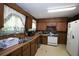 Kitchen with light countertops, stainless steel sink, and white appliances at 3043 Alston Dr, Decatur, GA 30032