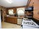 Kitchen with light countertops, stainless steel sink, and white appliances at 3043 Alston Dr, Decatur, GA 30032
