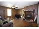 Living room with wood paneling, fireplace, window and hardwood floors at 3043 Alston Dr, Decatur, GA 30032