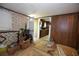 Room with floral wallpaper, missing flooring, and construction material at 3043 Alston Dr, Decatur, GA 30032