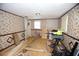 Room with floral wallpaper, missing flooring, and construction material at 3043 Alston Dr, Decatur, GA 30032