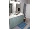 Bathroom featuring a double vanity with marble countertops and sleek, modern fixtures at 3152 Spruce Way, Atlanta, GA 30349
