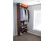 Bedroom closet featuring wood shelving with clothes, shoes, and storage boxes at 3152 Spruce Way, Atlanta, GA 30349