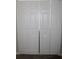 Hallway closet with standard white bifold doors and carpeted floor at 3152 Spruce Way, Atlanta, GA 30349
