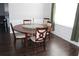 Dining room features dark wood table and chairs with dark hardwood floors at 3152 Spruce Way, Atlanta, GA 30349