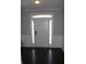 Inviting foyer with paneled walls, tiled floor, and a bright white front door with sidelights at 3152 Spruce Way, Atlanta, GA 30349