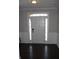 Inviting foyer with a bright white front door, sidelights, and dark wood flooring at 3152 Spruce Way, Atlanta, GA 30349