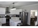 Contemporary kitchen with stainless steel appliances, granite countertops, and white cabinets at 3152 Spruce Way, Atlanta, GA 30349