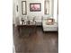 Spacious living room with dark hardwood floors, white sofa and coffee table at 3152 Spruce Way, Atlanta, GA 30349