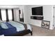 Spacious bedroom with neutral walls, large bed, wall mounted TV, and windows at 3152 Spruce Way, Atlanta, GA 30349
