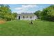 Well-maintained backyard with green lawn and view of house at 785 Alice St, Forest Park, GA 30297