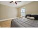Serene bedroom with hardwood floors, natural light, and light gray walls at 785 Alice St, Forest Park, GA 30297