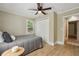 Bedroom with hardwood floors, a ceiling fan, and a cozy window at 785 Alice St, Forest Park, GA 30297