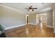 Spacious living room with hardwood floors, neutral walls and trim, and doorway to other rooms at 785 Alice St, Forest Park, GA 30297