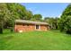 Backyard featuring a well-maintained lawn and mature trees at 1237 Gale Dr, Norcross, GA 30093