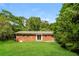 Spacious backyard features a well-maintained lawn and mature trees at 1237 Gale Dr, Norcross, GA 30093