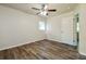 Bedroom with neutral walls, ceiling fan, and wood-look floors at 1237 Gale Dr, Norcross, GA 30093