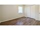 Bedroom featuring wood-look floors, closet, and window at 1237 Gale Dr, Norcross, GA 30093