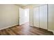 Bedroom with wood-look floors, closet, and door at 1237 Gale Dr, Norcross, GA 30093