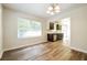 Sunlit dining room with wood floors, connects to a modern kitchen for easy entertaining at 1237 Gale Dr, Norcross, GA 30093
