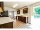 Modern kitchen with stainless steel appliances, wood cabinets, and access to the backyard at 1237 Gale Dr, Norcross, GA 30093