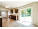 Updated kitchen with stainless steel appliances and sliding door to the backyard at 1237 Gale Dr, Norcross, GA 30093