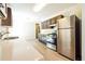 Kitchen featuring stainless steel appliances, wooden cabinets, and lots of countertop space at 1237 Gale Dr, Norcross, GA 30093