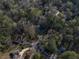 Aerial view of the neighborhood with houses surrounded by lush green trees at 1351 Stephens Sw St, Lilburn, GA 30047