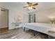 Bright bedroom with wood floors, a vanity, closet, and a large window at 1351 Stephens Sw St, Lilburn, GA 30047