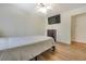 This is a bedroom with hardwood floors, a TV, and a ceiling fan at 1351 Stephens Sw St, Lilburn, GA 30047