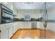Functional kitchen with stainless steel appliances, plenty of cabinet storage, and natural light at 1351 Stephens Sw St, Lilburn, GA 30047