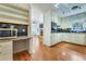 Eat-in kitchen featuring updated countertops, white cabinets and stainless steel appliances at 1351 Stephens Sw St, Lilburn, GA 30047