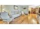 Bright living room featuring hardwood floors, neutral walls, and comfortable seating area at 1351 Stephens Sw St, Lilburn, GA 30047