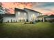 Expansive backyard featuring lush green lawn and outdoor living space under a covered patio, perfect for relaxing or entertaining at 2127 Harmony Dr, Canton, GA 30115