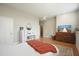 Bedroom with wood flooring, simple furnishings, and large television for relaxation and enjoyment at 2127 Harmony Dr, Canton, GA 30115