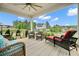 Inviting covered porch with ceiling fan and wicker chairs offer a relaxing outdoor space at 2127 Harmony Dr, Canton, GA 30115