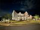 Charming front exterior with landscaped yard and brick accents at twilight at 2127 Harmony Dr, Canton, GA 30115