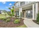 Inviting front porch with cozy seating, manicured garden beds, and a stylish front door at 2127 Harmony Dr, Canton, GA 30115