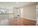 Upstairs hallway with hardwood floors, neutral walls, and doorways leading to bedrooms and living areas at 2127 Harmony Dr, Canton, GA 30115