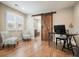 Bright home office space with wood floors, sliding barn door, and natural light at 2127 Harmony Dr, Canton, GA 30115