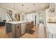 Well-designed kitchen island with stainless steel appliances, modern lighting, and a seamless connection to the living areas at 2127 Harmony Dr, Canton, GA 30115