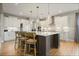 Stylish kitchen with a center island, pendant lighting, modern appliances, and ample cabinet space at 2127 Harmony Dr, Canton, GA 30115