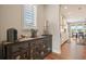 Coffee bar area featuring a wooden cabinet with glass doors and a window bringing in lots of light at 2127 Harmony Dr, Canton, GA 30115