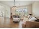 Open-concept living room with hardwood floors, large windows and light neutral paint at 2127 Harmony Dr, Canton, GA 30115