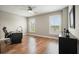 Sunlit office with hardwood floors offers two windows and a built-in cabinet at 2127 Harmony Dr, Canton, GA 30115