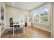Bright home office with hardwood floors, large windows, and a functional workspace at 2127 Harmony Dr, Canton, GA 30115