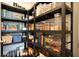 Organized pantry with ample shelving and a variety of food items stored in clear containers at 2127 Harmony Dr, Canton, GA 30115