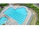 Aerial view of a community pool with lap lanes and lounge chairs around its perimeter at 2127 Harmony Dr, Canton, GA 30115
