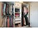 Organized walk-in closet features clothing racks, shelving, drawers and interior lighting at 2127 Harmony Dr, Canton, GA 30115
